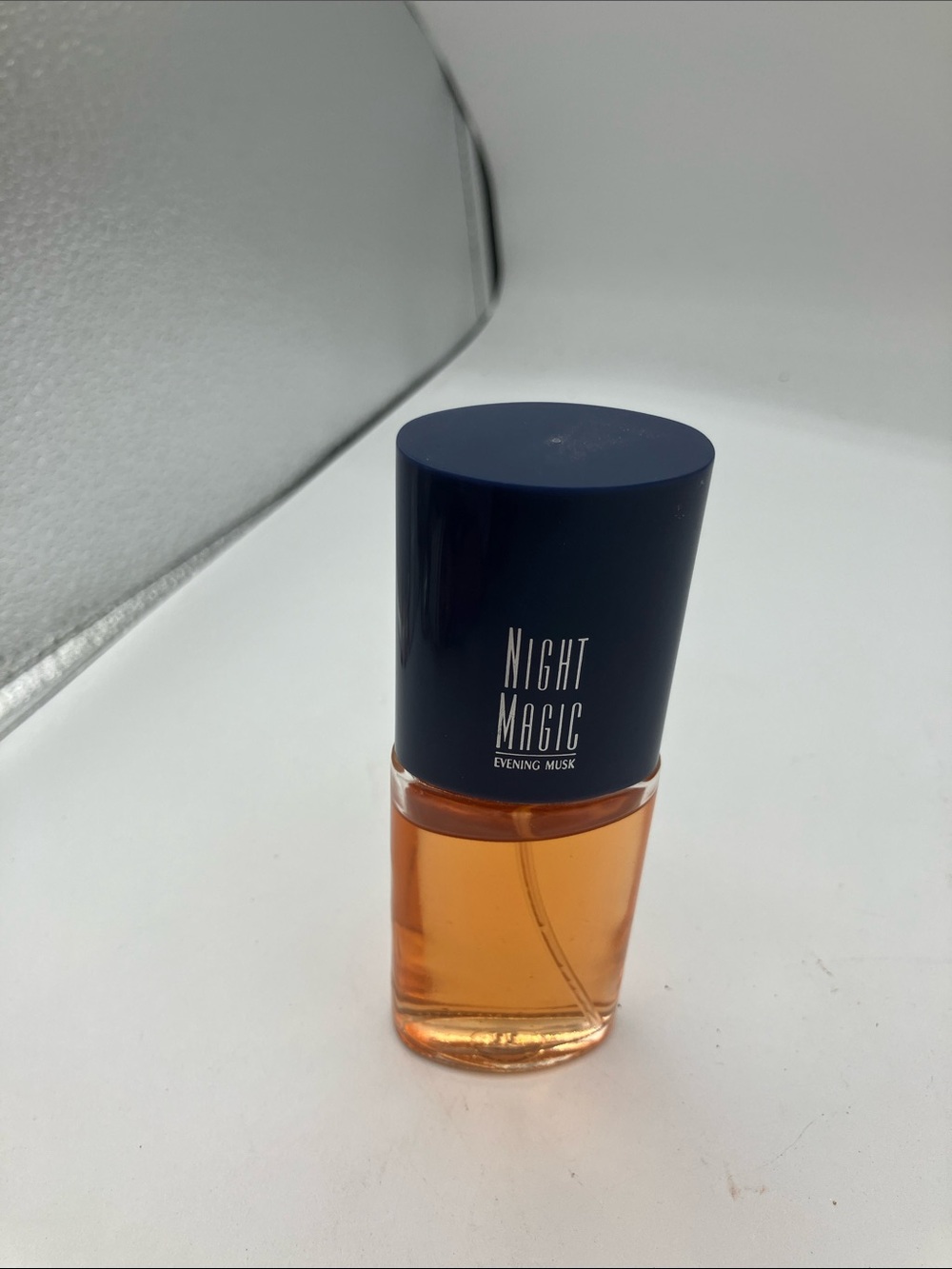 Avon Night Magic Evening Musk Bottle in Navy and Amber